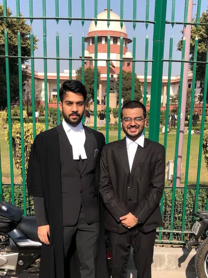 Pictured with a fellow advocate outside the Supreme Court complex. The professional bonds we build are integral to navigating the legal landscape together.