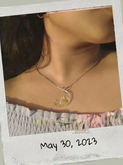 Here I am wearing the crescent moon pendant to show how it looks. It's lightweight and catches the light beautifully.