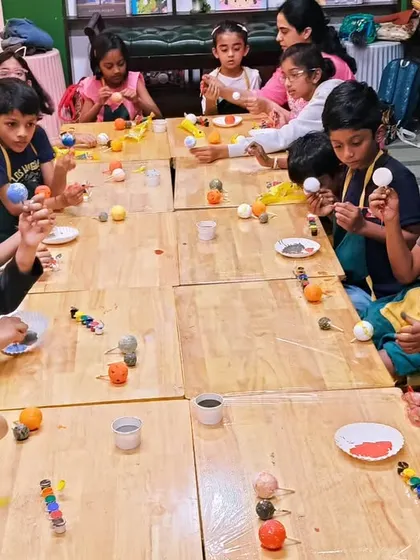 A classroom full of focused artists, each painting the planets for their solar system model. We provide all the materials and guidance needed for this engaging educational craft.
