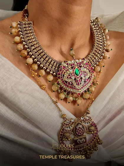 Layer your treasures and let every strand tell a divine story. This temple-inspired layered necklace features a heart-shaped pendant and intricate beadwork.