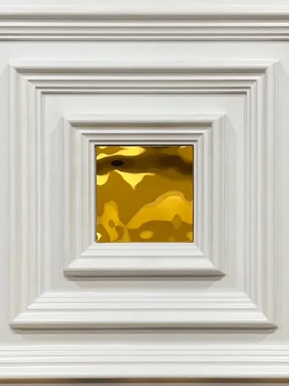 This white PVC panel features classic beveled frames with a striking gold mirror in the middle. The contrast makes it a sophisticated and eye-catching decorative element.