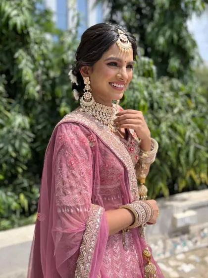 A happy and confident portrait of the bride. The makeup is designed to look flawless from every angle.