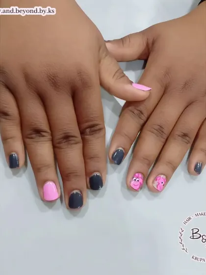 For the kid at heart! I hand-painted this adorable Peppa Pig design for a client. This set combines solid pink and grey gel polish with cute cartoon characters on the accent nails.