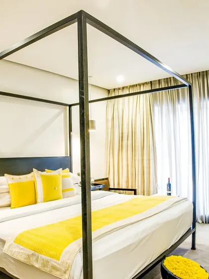 Sleep like royalty in our signature four-poster bed. This room combines classic elegance with modern design, featuring plush bedding and a bright, airy atmosphere for a truly restful night.