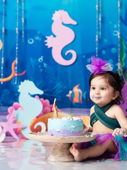 A little taste of birthday cake for our sweet little mermaid. The perfect end to a fun photoshoot.
