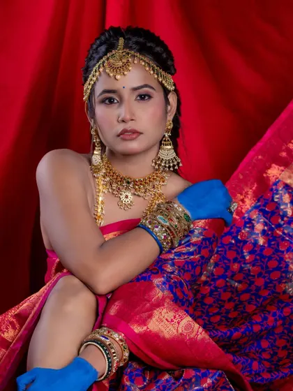 A direct and engaging portrait that showcases the beauty of the traditional jewellery in a modern, artistic context.