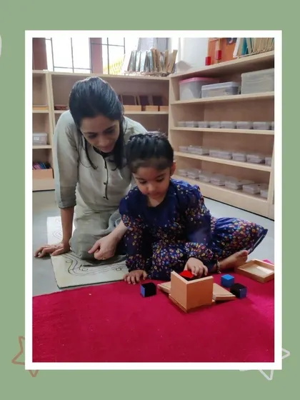 Hitha shows her mother how the binomial cube works. This activity is a fun, sensorial introduction to algebraic formulas, presented as an engaging three-dimensional puzzle.