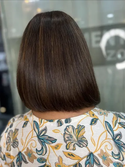 The back view of the smooth caramel brown bob, showing off the clean lines and glossy finish.