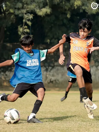 A strong but fair tackle during a U13 match.