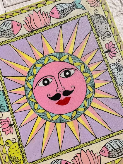 A close-up of my pastel Madhubani painting of Surya Dev, created in gratitude to the sun for Chhath Puja. The design features traditional fish and lotus motifs.