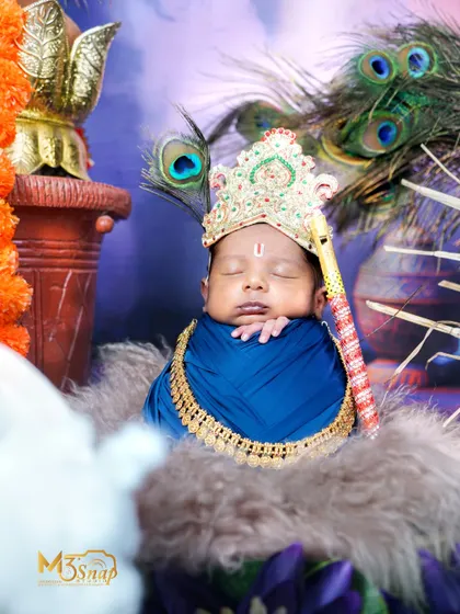 A serene portrait of the baby as Krishna, with a peacock feather in his crown. The lighting and composition create a truly magical feel.