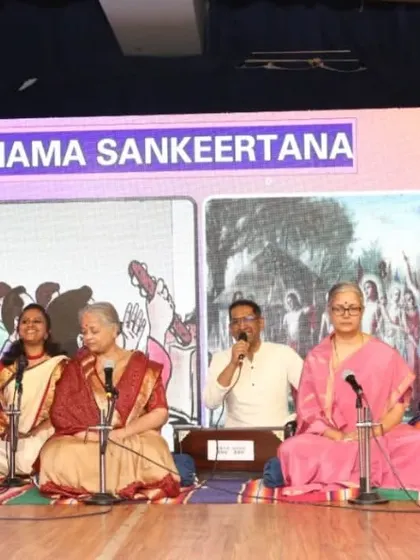 A group of students performing Nama Sankeertana (devotional singing) on stage during our anniversary event.