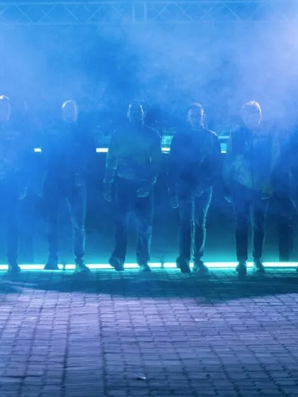 An atmospheric shot of the "To Da Bone" dance crew on a smoke-filled stage. This image captures the intense, rebellious energy of the jumpstyle performance we hosted.