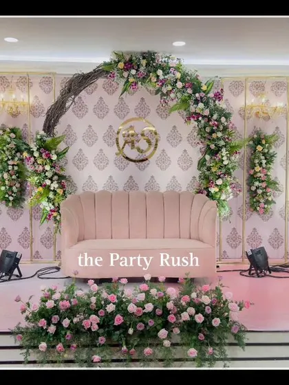 The stage is set for a beautiful engagement ceremony. I used a floral arch with blush and white roses, elegant candelabras, and a soft pink color palette to create a romantic and timeless atmosphere for the happy couple.