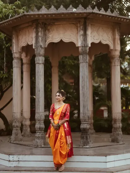 A full-length view of the bride in her stunning nauvari saree. I provide saree draping services to ensure the entire look is cohesive and elegant.