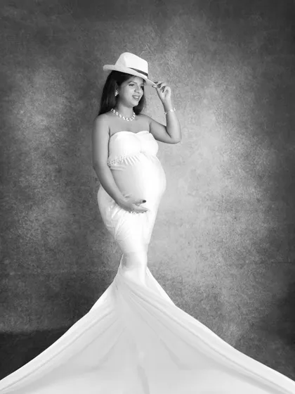 A stylish black and white version of the drape portrait with a hat. The monochrome edit gives it a classic, almost vintage Hollywood feel.