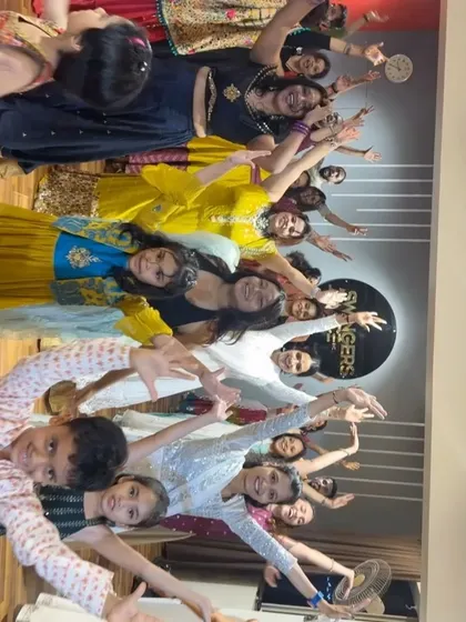 A creative group pose from our Garba celebration. We love seeing our students express their joy and creativity.