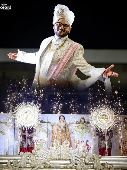 A creative double exposure shot of the groom during his grand entrance, combined with a view of the stage and fireworks. This is my cinematic style in action.