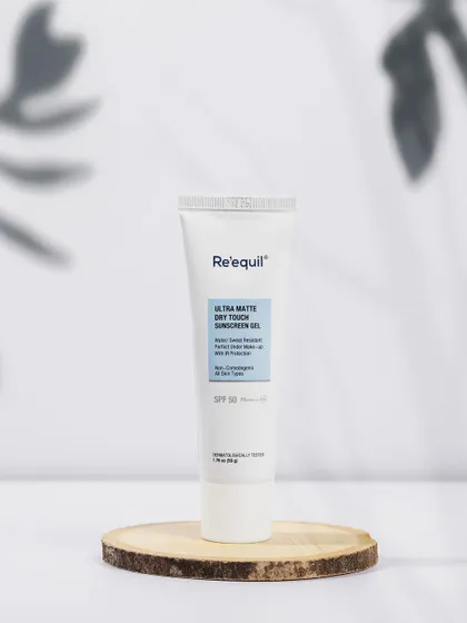 This shot for Re'equil sunscreen uses a wooden slice and soft, natural-looking light to communicate a gentle, organic feel. The composition is clean and perfect for website banners or product pages.