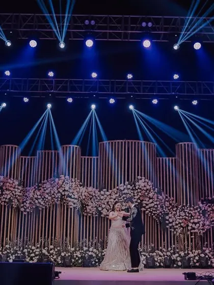 The first dance on a spectacular stage. We use dramatic lighting and wide angles to capture the scale of your sangeet or reception decor, making your performance look as grand and cinematic as it felt.