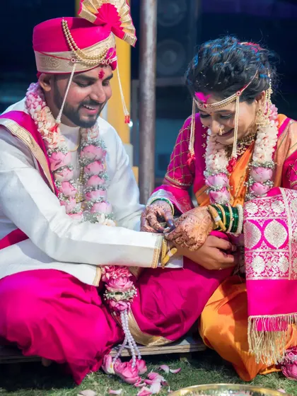 The couple engages in a post-wedding game, a fun tradition that brings laughter and joy to the ceremony.