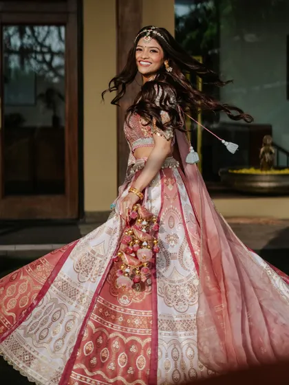 A fun, twirling shot that shows off Utsavi's stunning lehenga and her beautiful, flowing hair.