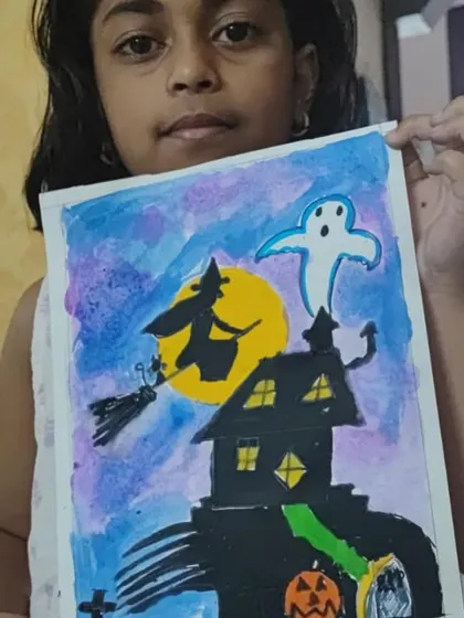 A spooky haunted house painting by one of my online students for Halloween. The purple and blue watercolor background creates a perfect eerie mood.