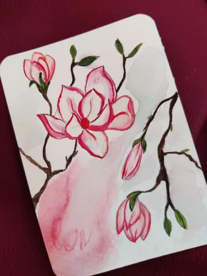 A simple and elegant painting of magnolia blossoms on a branch. This style is perfect for a minimalist aesthetic, focusing on clean lines and soft color washes.