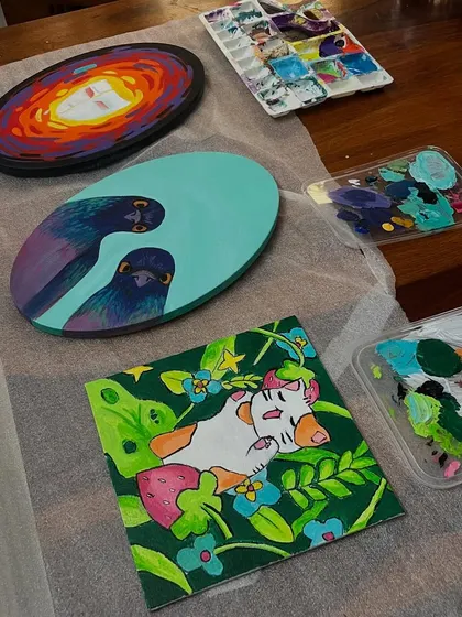 The results of a wonderful painting night. You can see a few different original pieces here, each with its own unique and quirky style.