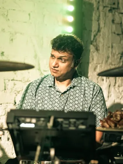 A close-up of our drummer's intricate setup. His combination of a standard drum kit with electronic pads allows for a wide range of sonic possibilities.