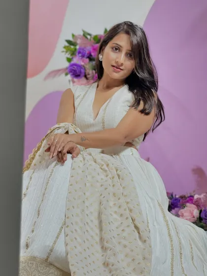 Another angle of the white lehenga set, showing how gracefully the dupatta drapes. This is a timeless piece you can rent for any special occasion where you want to look effortlessly chic.