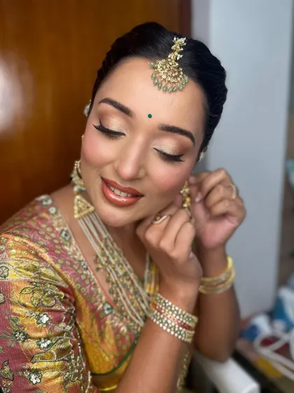A beautiful shot capturing the details of the eye makeup and the traditional jewelry.