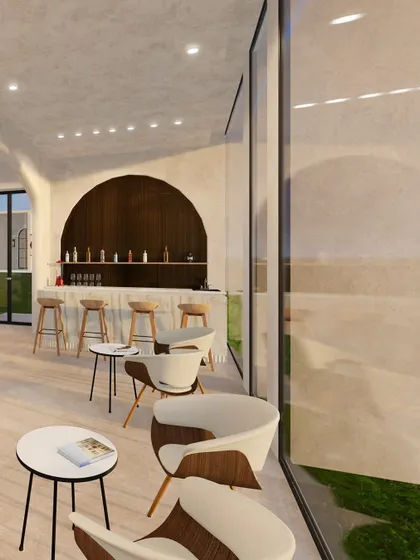 The Hydro Bar offers a space for relaxation and rehydration post-workout. I designed it with an arched wood-paneled backdrop and large windows overlooking a lush green space, creating a seamless connection between the interior and the natural environment.