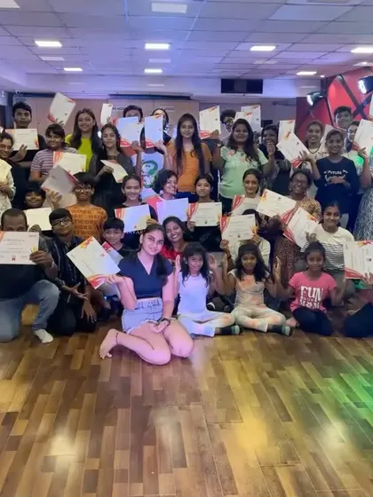 A group of our summer camp students proudly displaying their completion certificates. We believe in recognizing the effort and progress of every dancer.