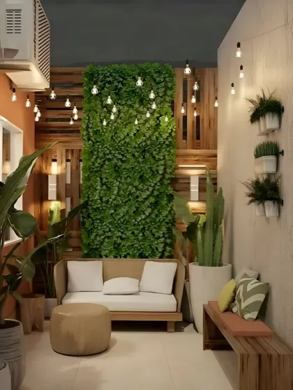 This small balcony is transformed into a lush green retreat with a large vertical garden wall. The simple wooden sofa and bench provide comfortable seating, making it a perfect spot to unwind.