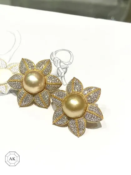 From sketch to splendor. These bespoke floral earrings unite golden South Sea pearls with brilliant diamonds, designed to be treasured heirlooms.