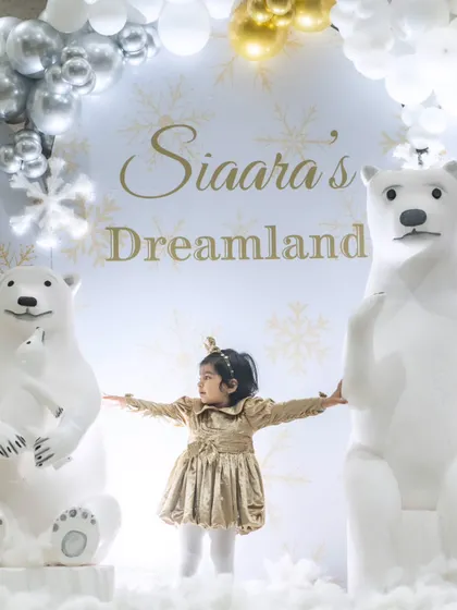 A perfect photo moment for the birthday girl amidst the enchanting winter wonderland setup we created.