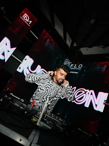 A dramatic, low-angle shot of me at the decks, ready to ring in the New Year. I'm ready to make your big celebrations epic.