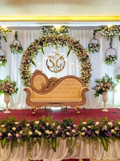 The full view of the stage with hanging floral decor.