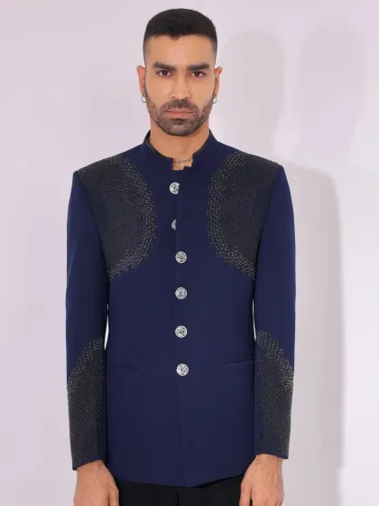A close-up of the textured panels on the navy Jodhpuri.