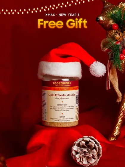 Every party hamper comes with a little something extra. This image shows the free gift, a jar of my special Cola and Soda Masala, perfect for creating fizzy, flavourful drinks.