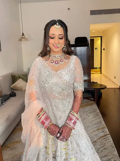 A happy and glowing bride. Tanvi's smile says it all. Her makeup was designed to be fresh and luminous, perfect for her wedding day.