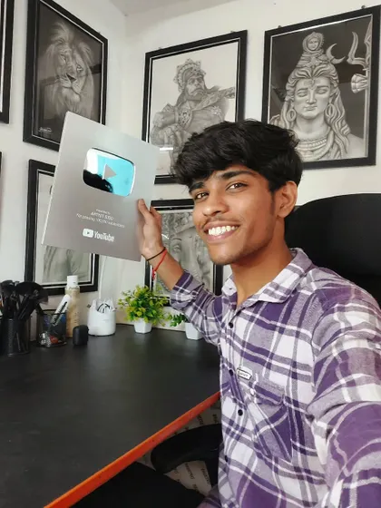 Another happy picture with my silver play button. This achievement motivates me to work even harder.