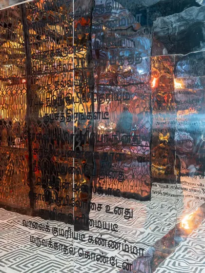 Personalization is key. For this Sangeet, we took a Tamil poem shared by the bride and blew it up into a stunning art installation, weaving her personal story directly into the decor.