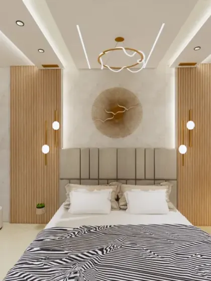 This bedroom is a perfect example of a multi-functional space, with a comfortable bed, a dedicated study nook, and a vanity area with a large circular mirror.