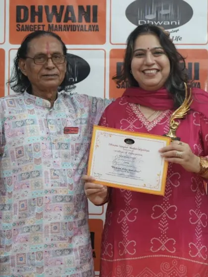 An adult student with her guru, a moment of achievement.