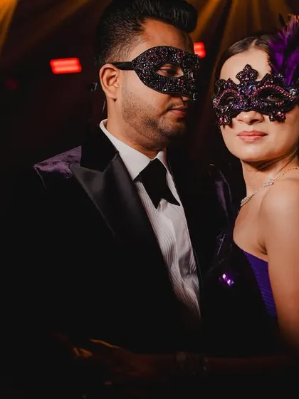 The custom-made masks were the final touch for this masquerade theme, adding an element of mystery and tying their entire look together.