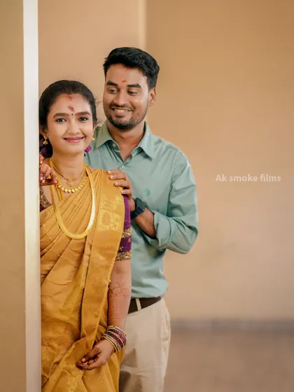 A sweet and simple portrait from a Pondicherry wedding, with the groom peeking from behind the bride.
