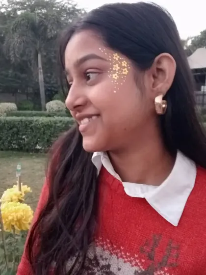 A subtle yet beautiful spray of gold glitter on the side of the face. It looks like golden freckles.