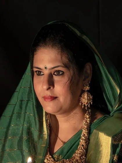 Another portrait from the Diwali series, capturing a serene and traditional mood with a green saree and antique gold jewelry.